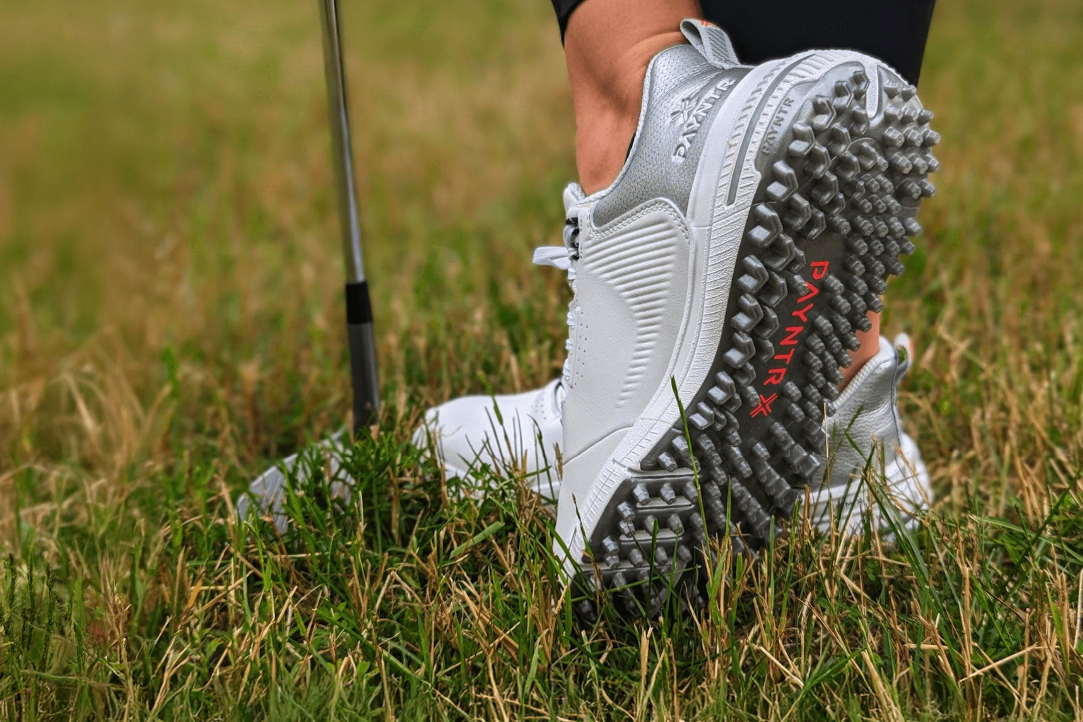 Woman golfer wearing PAYNTR X-003 Women's Spikeless Golf Shoes